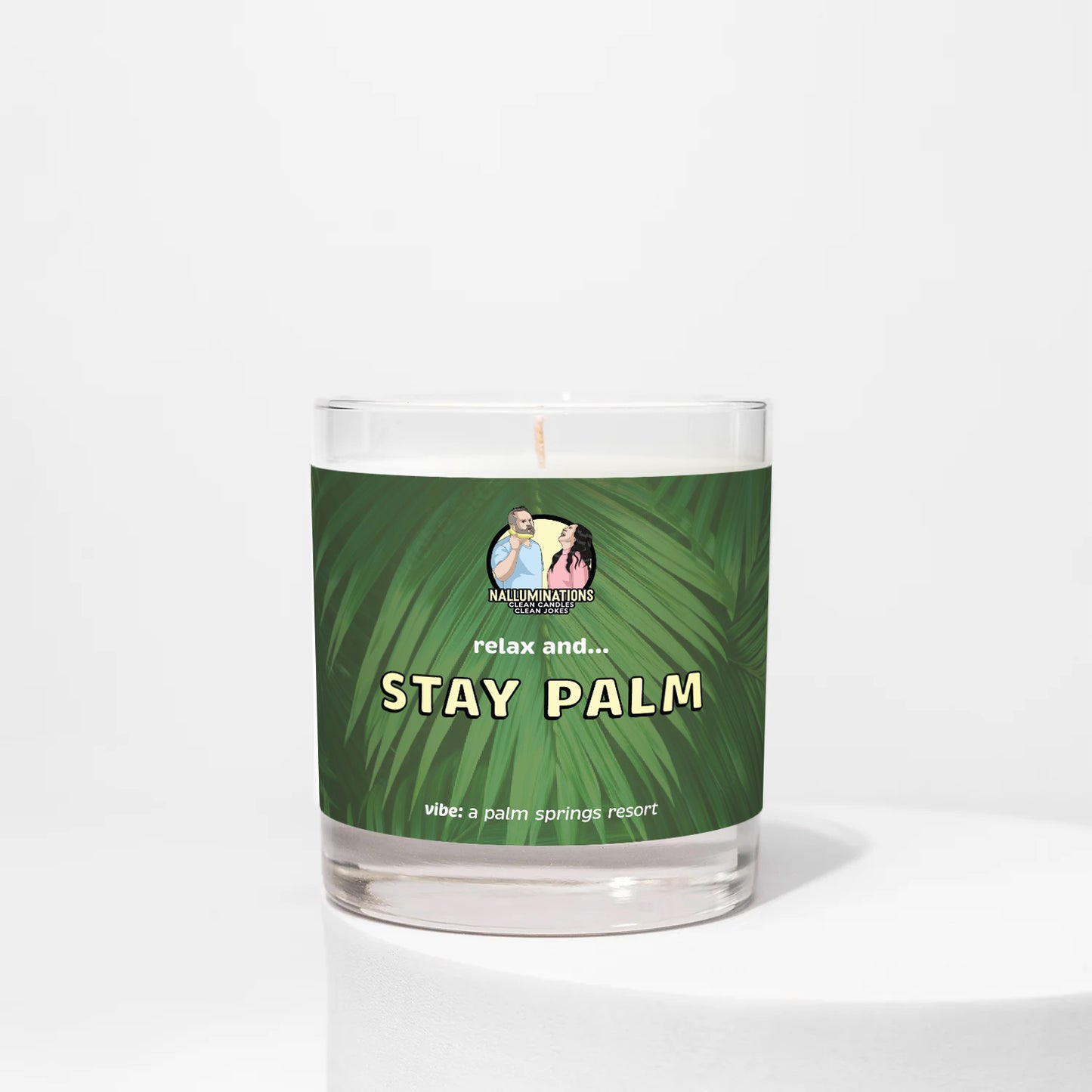 Stay Palm – resort-inspired funny coconut soy candle with green tea and rose petals in 8oz clear glass jar with green palm label, photographed on white background.