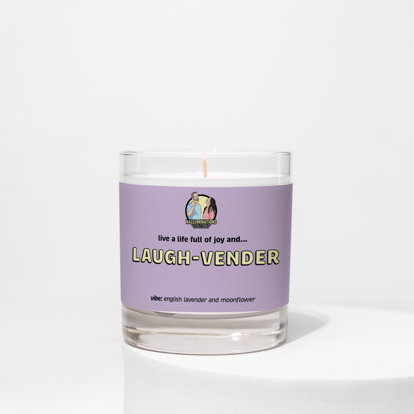 Laugh-vender – lavender and moonflower scented funny coconut soy candle in 8oz clear glass jar with lavender label, photographed on white background.