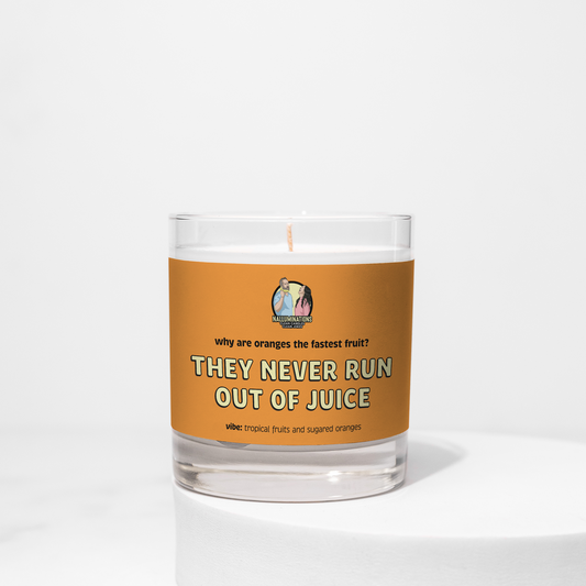 Run Out of Juice – tropical fruity funny coconut soy candle with citrus and sugared oranges in 8oz clear glass jar with orange label, photographed on white background.