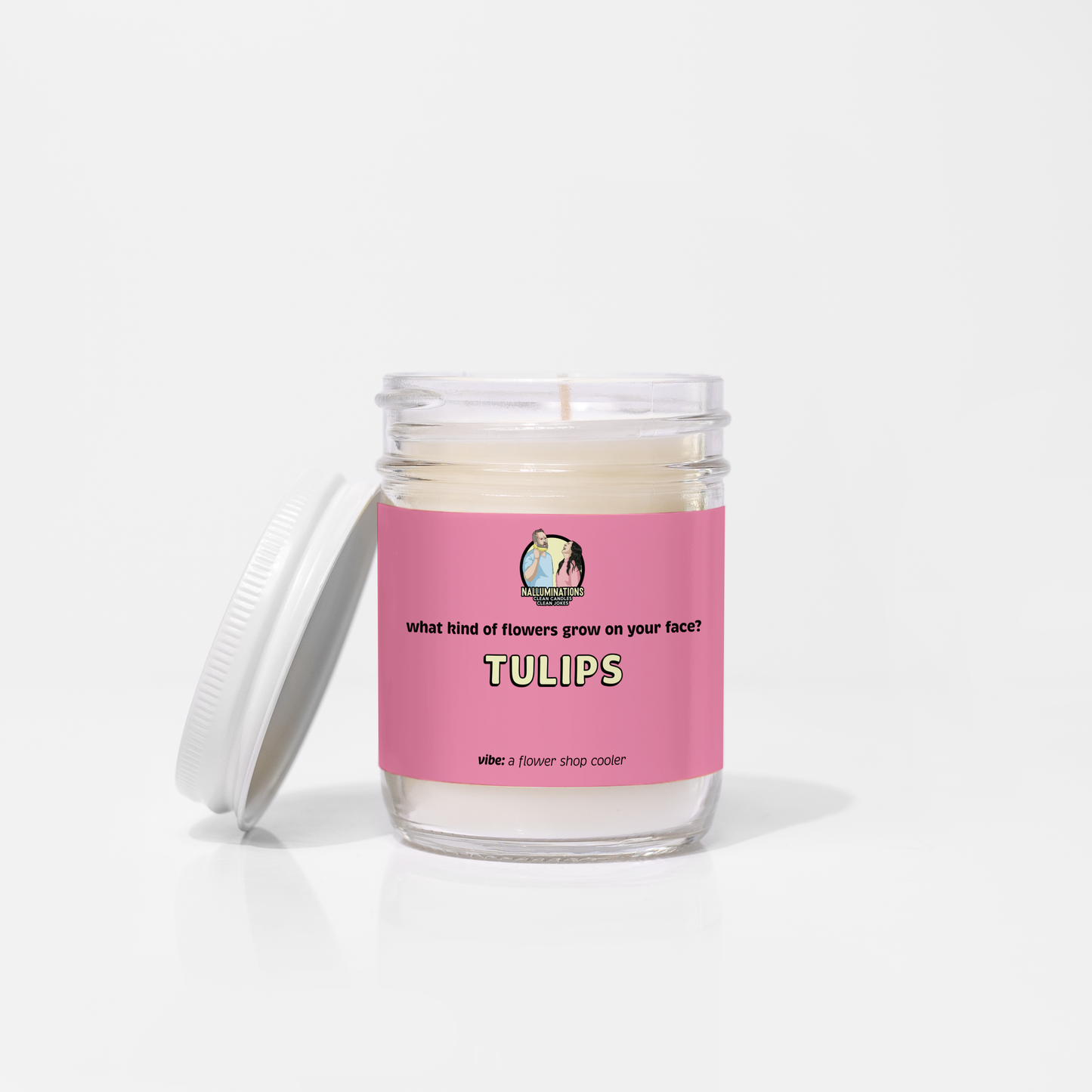 Tulips – flower shop scented funny coconut soy candle in 6.5oz clear glass jar with white lid and pink label, photographed on white background.