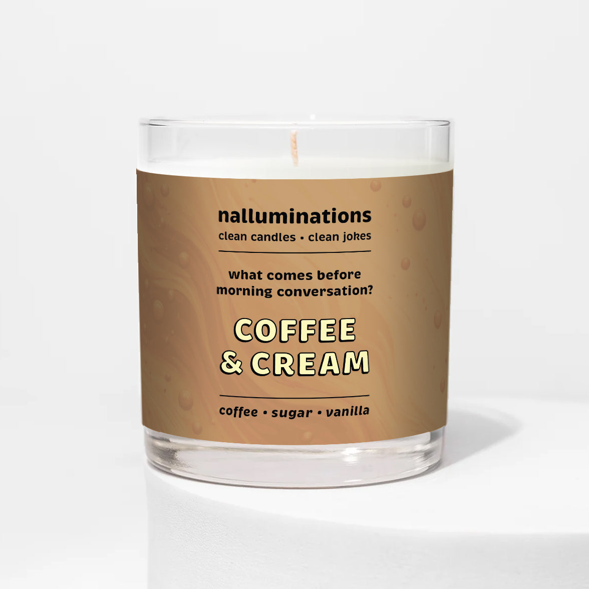 Nalluminations 8oz coconut soy candle in a clear glass vessel with a brown label on a white background